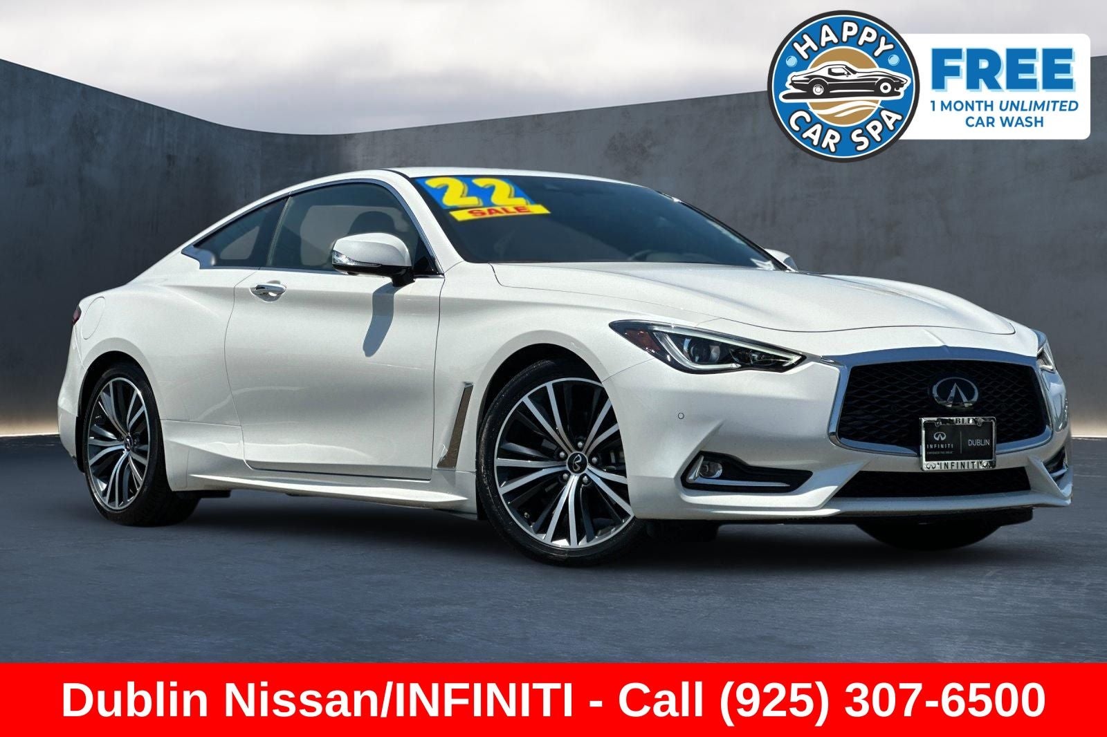 2022 INFINITI Q60 LUXE in Majestic White — front three-quarter view